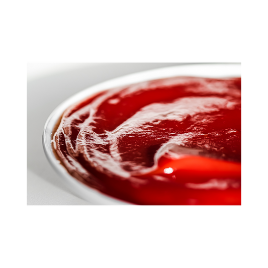 a white bowl filled with homemade red tomato catsup