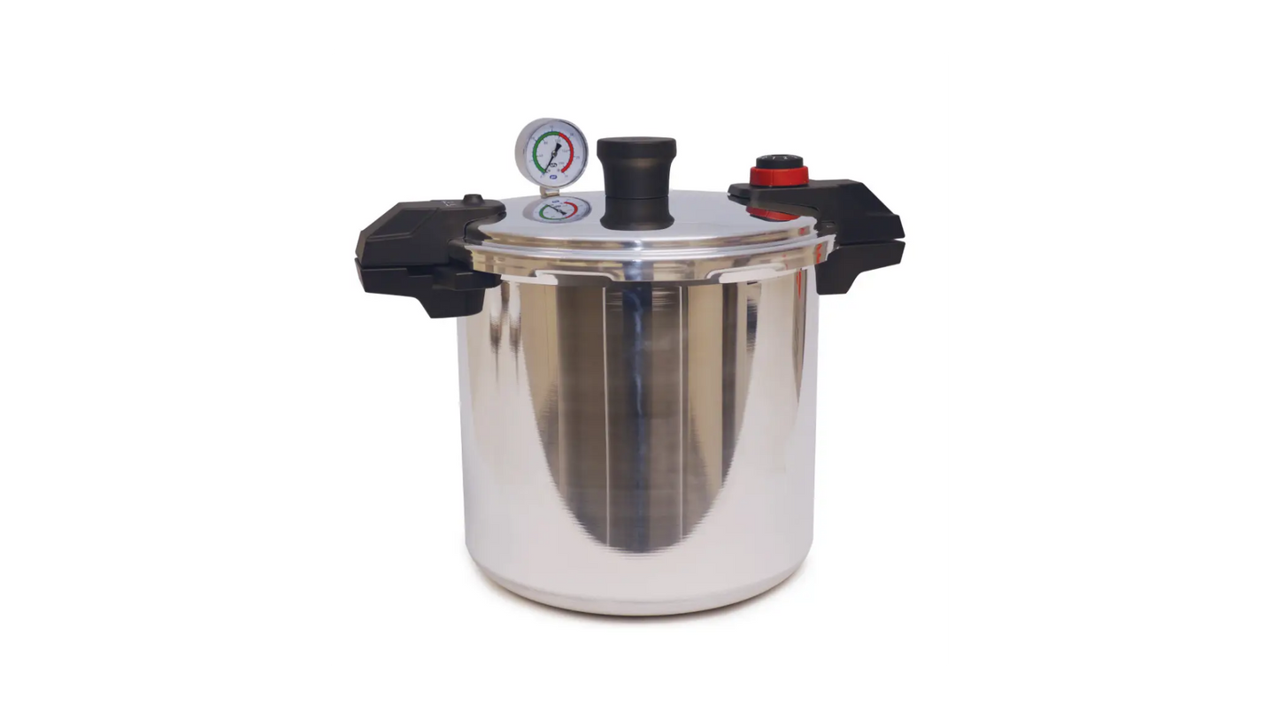 A shiny metal pressure cooker canner pot with black handles and a lid with a pressure dial.